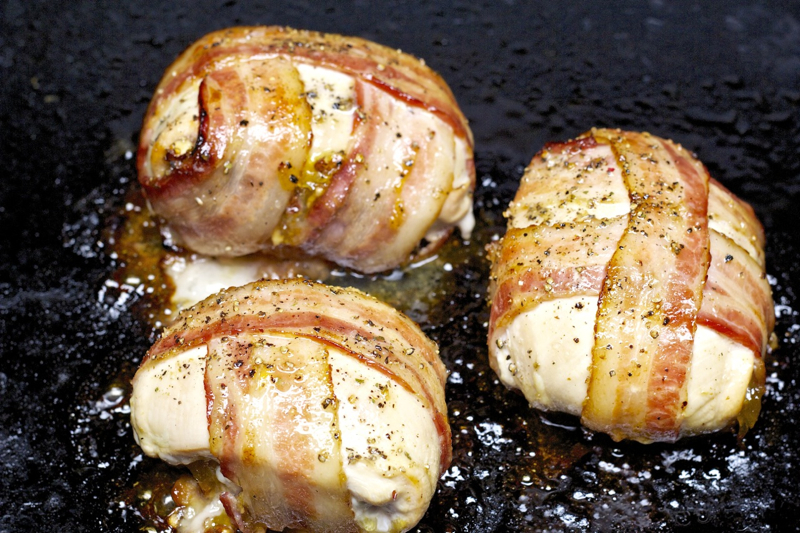 Grilled bacon-wrapped stuffed chicken breasts on the Island Grillstone