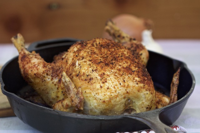 Whole chicken cooked in a cast iron skillet on the grill | Cooking-Outdoors.com | Gary House