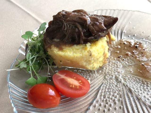 Braised short ribs on four cheese polenta and a wine reduction sauce | NevertoOldtoTravel.com | Gary House